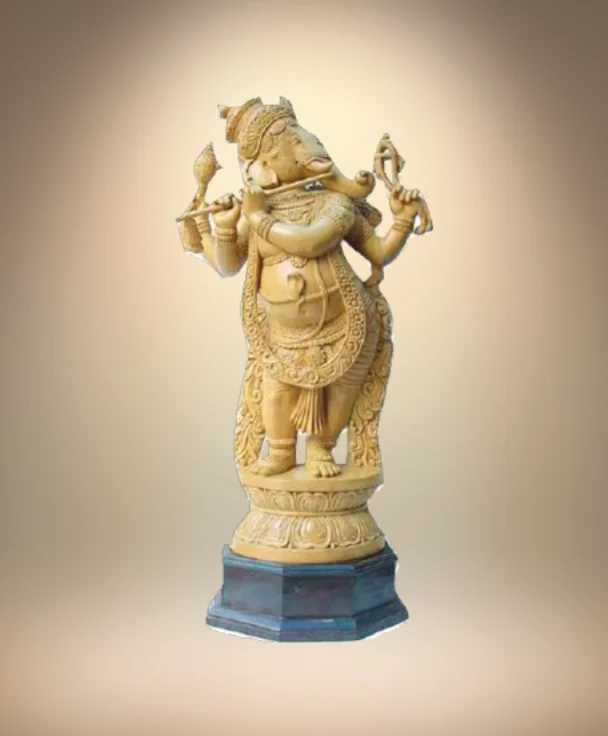Hand-carved wooden figure on a plinth